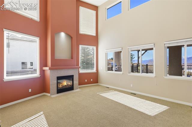 15090 Ridgefield Lane Colorado Springs, CO 80921 - Photo 19 of 50 Two Story Great Room with Gas Fireplace and an Abundance of Natural Light!