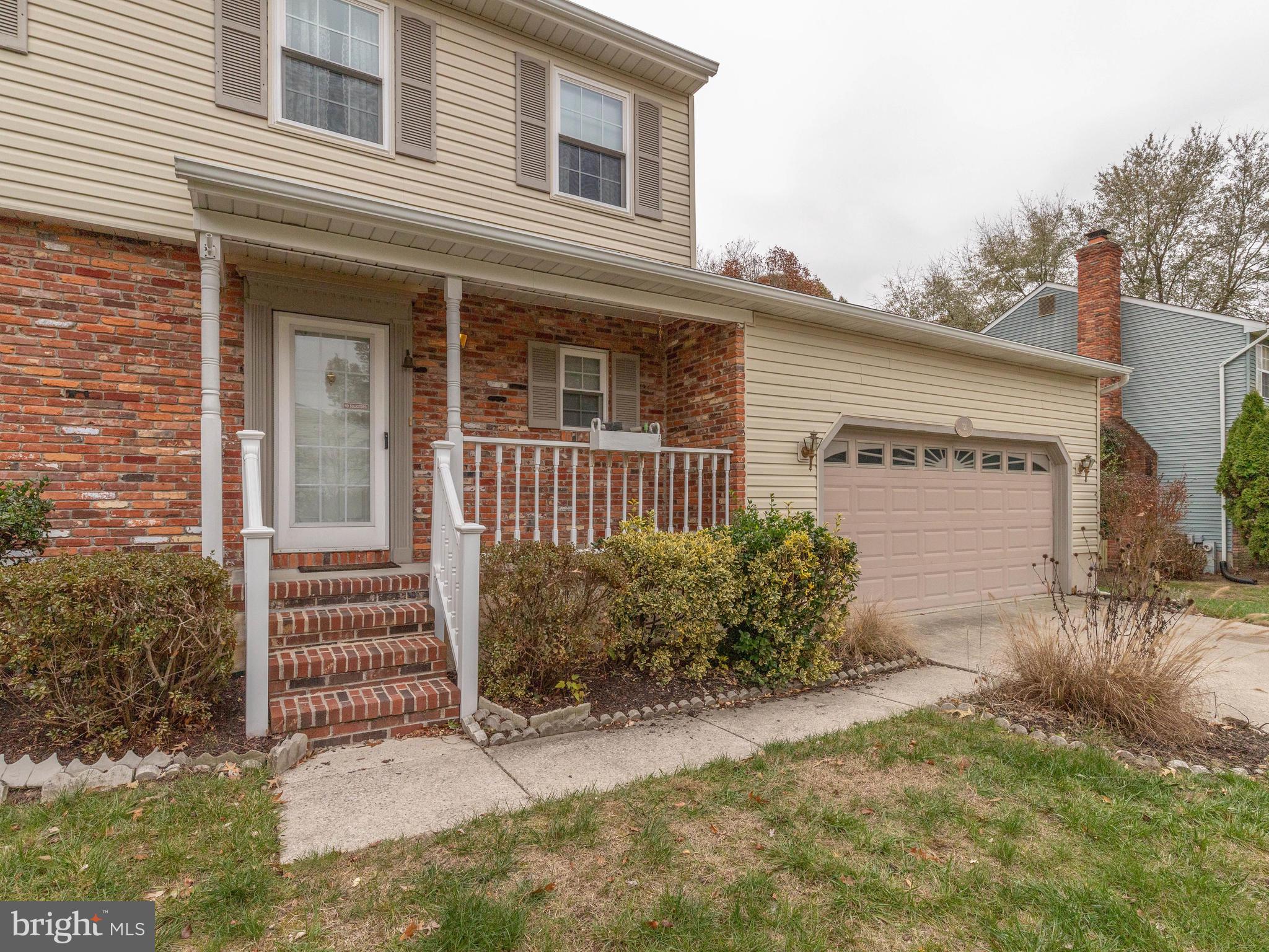 Brick & Concrete covered front porch