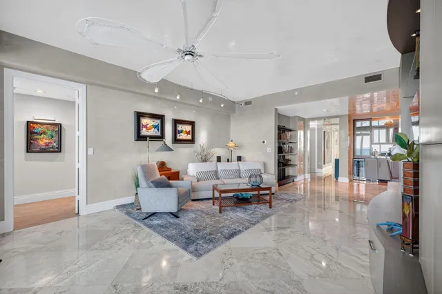 a view of a swimming pool with a table and chairs