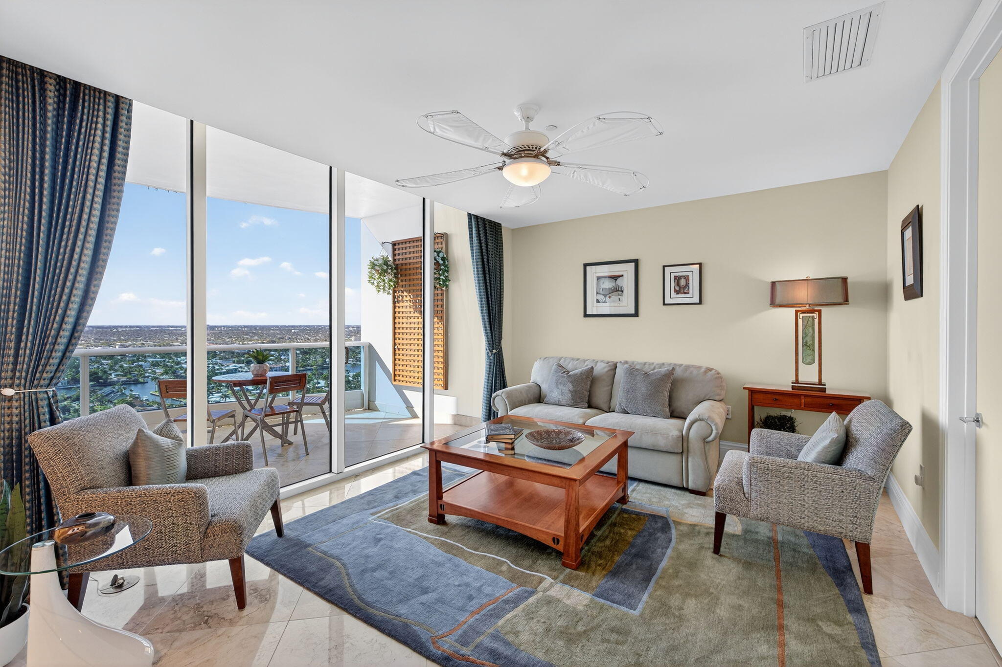 1600 South Ocean Boulevard, Unit MPH02 Lauderdale-by-the-Sea, FL 33062 - Photo 39 of 71 a living room with furniture a table and a large window