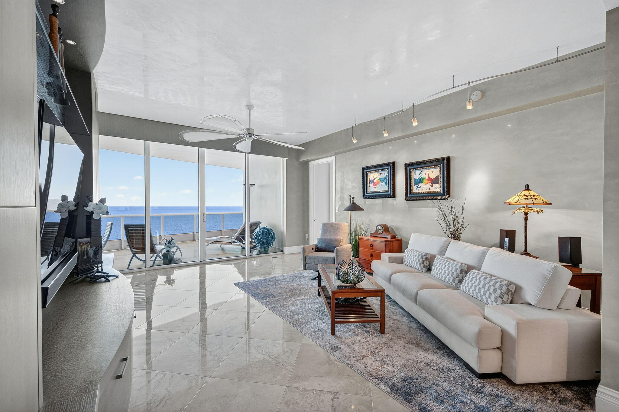 1600 South Ocean Boulevard, Unit MPH02 Lauderdale-by-the-Sea, FL 33062 - Photo 9 of 71 a living room with furniture and a floor to ceiling window