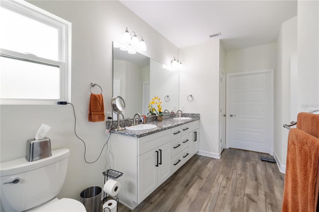 5149 Southwest 119th Road Lake Butler, FL 32054 - Photo 24 of 40 a bathroom with a sink mirror and toilet