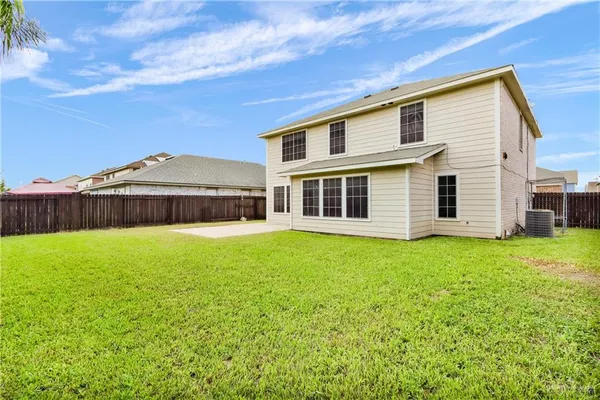an aerial view of residential houses with outdoor space and swimming pool
