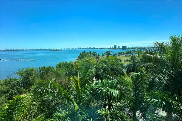 a view of a lake and green space