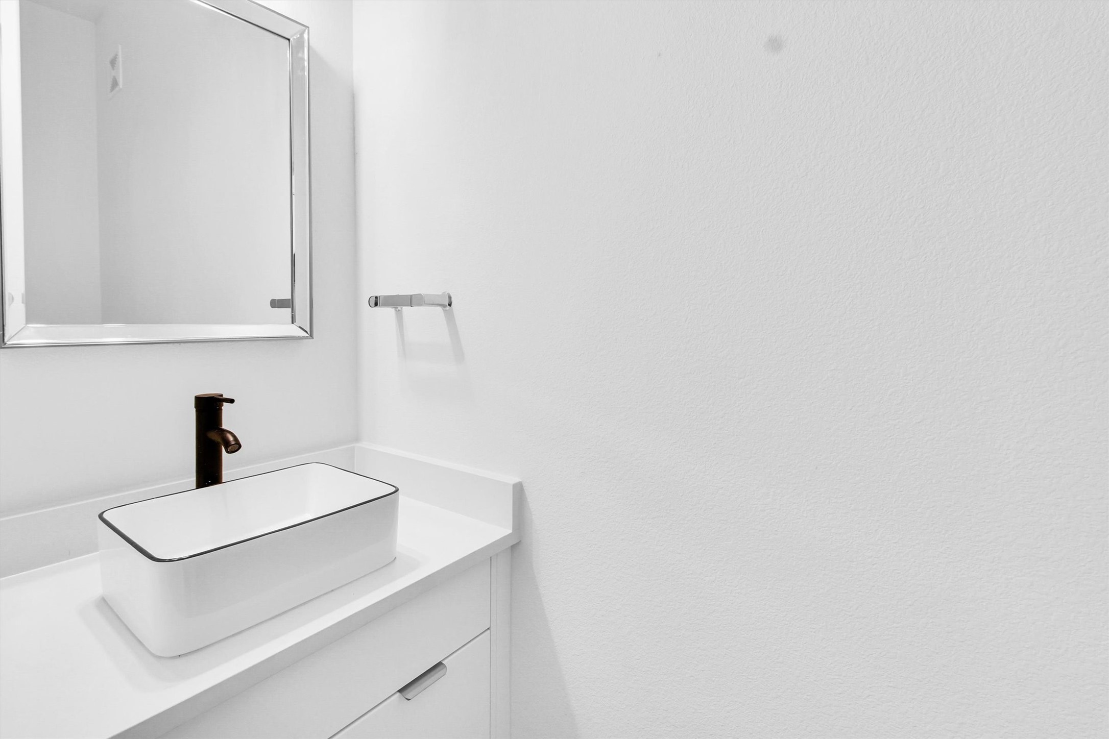 5325 Rue Street Houston, TX 77033 - Photo 11 of 34 a white sink sitting next to a white cabinet