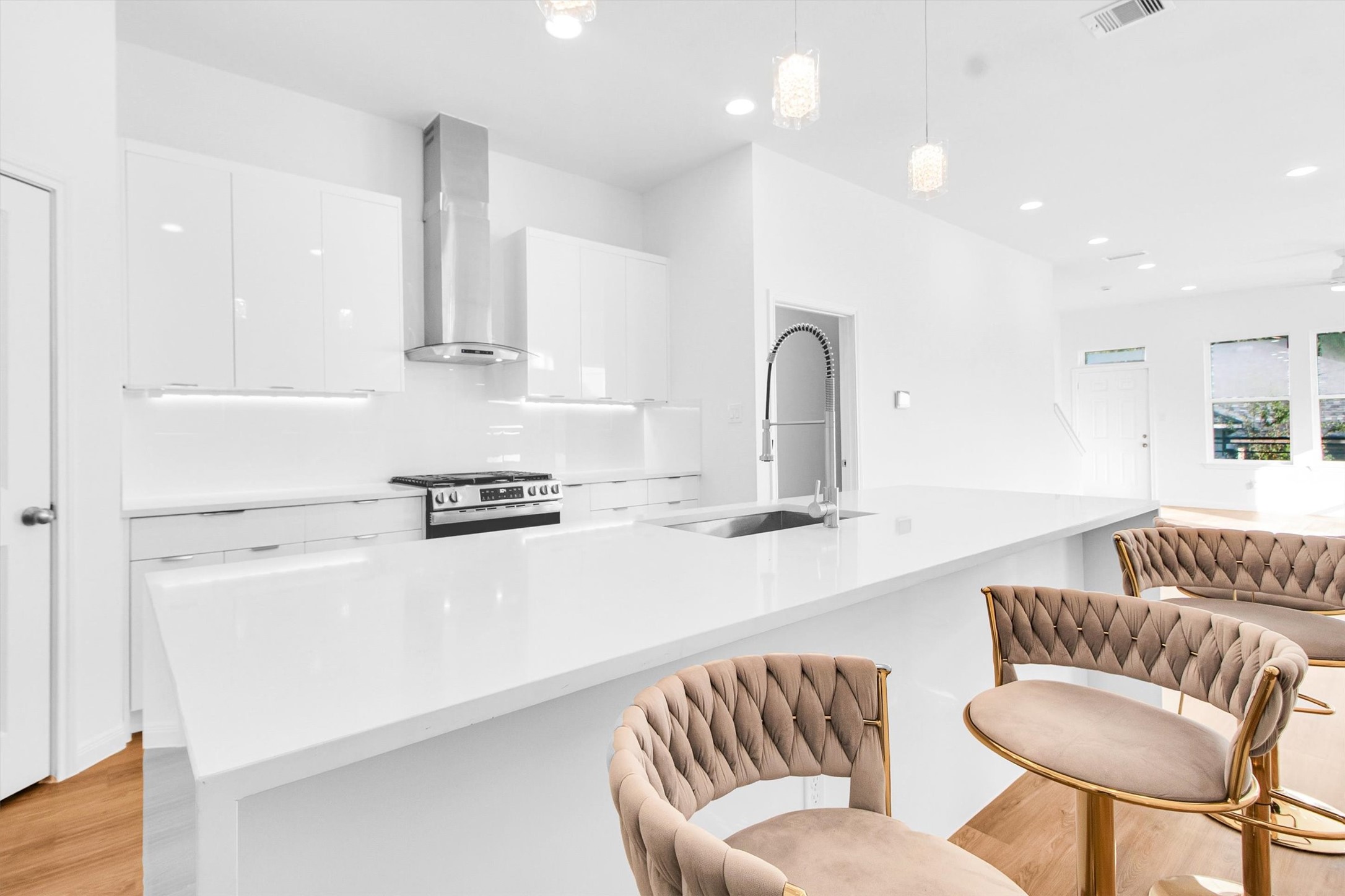 5325 Rue Street Houston, TX 77033 - Photo 13 of 34 a kitchen with stainless steel appliances granite countertop a stove a sink a dining table and chairs