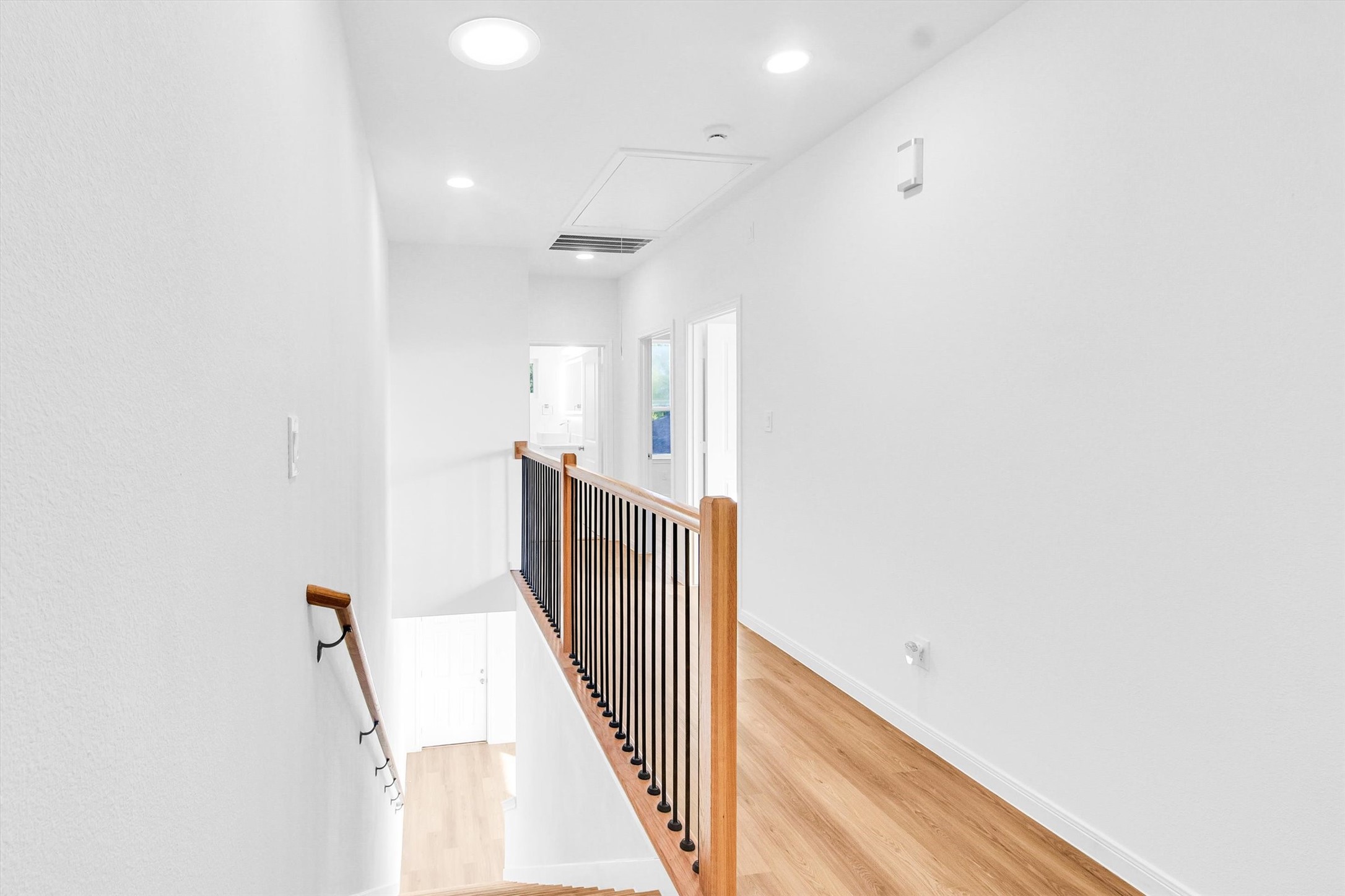 5325 Rue Street Houston, TX 77033 - Photo 17 of 34 a view of a hallway with wooden floor
