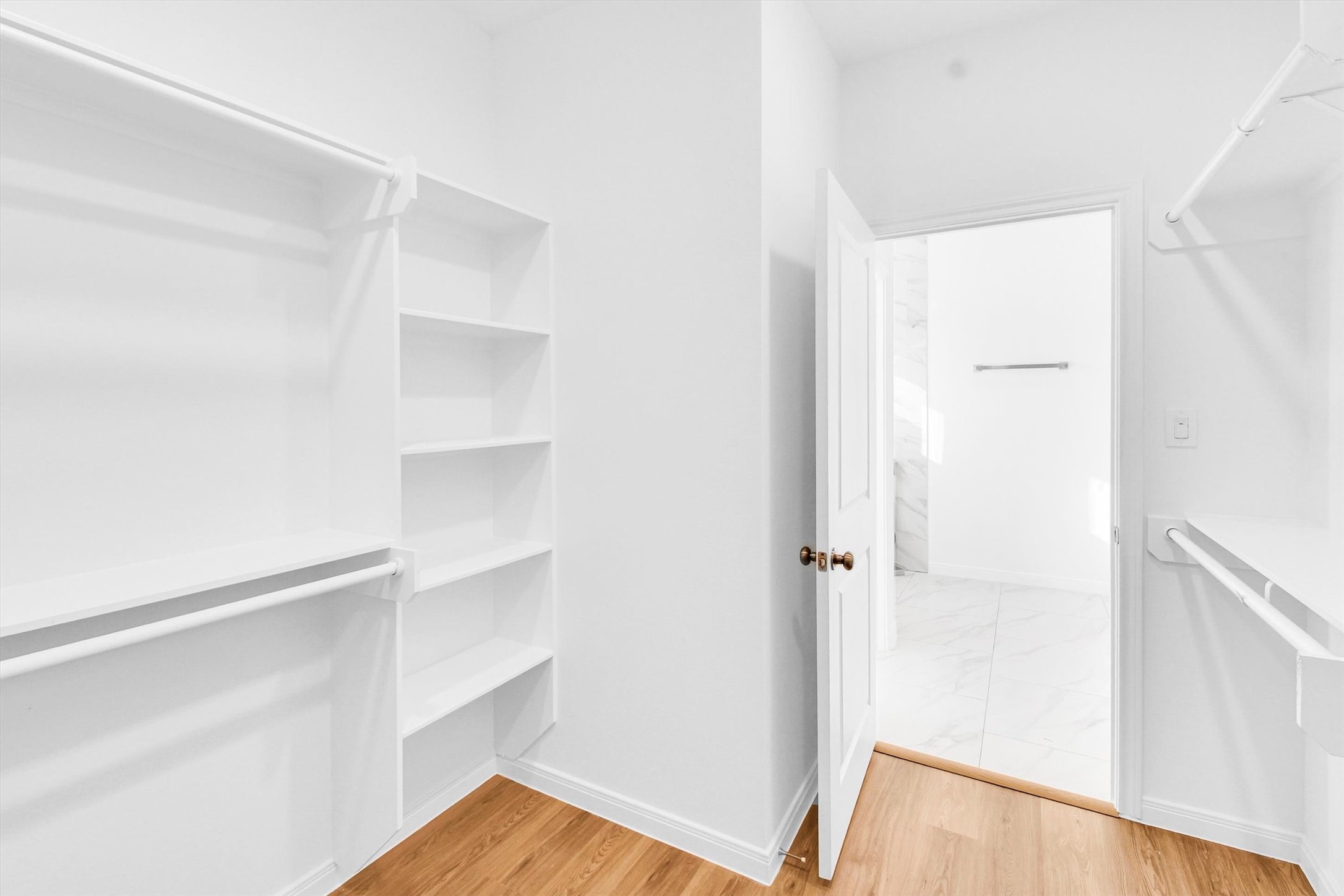 5325 Rue Street Houston, TX 77033 - Photo 22 of 34 a view of walk in closet with empty racks