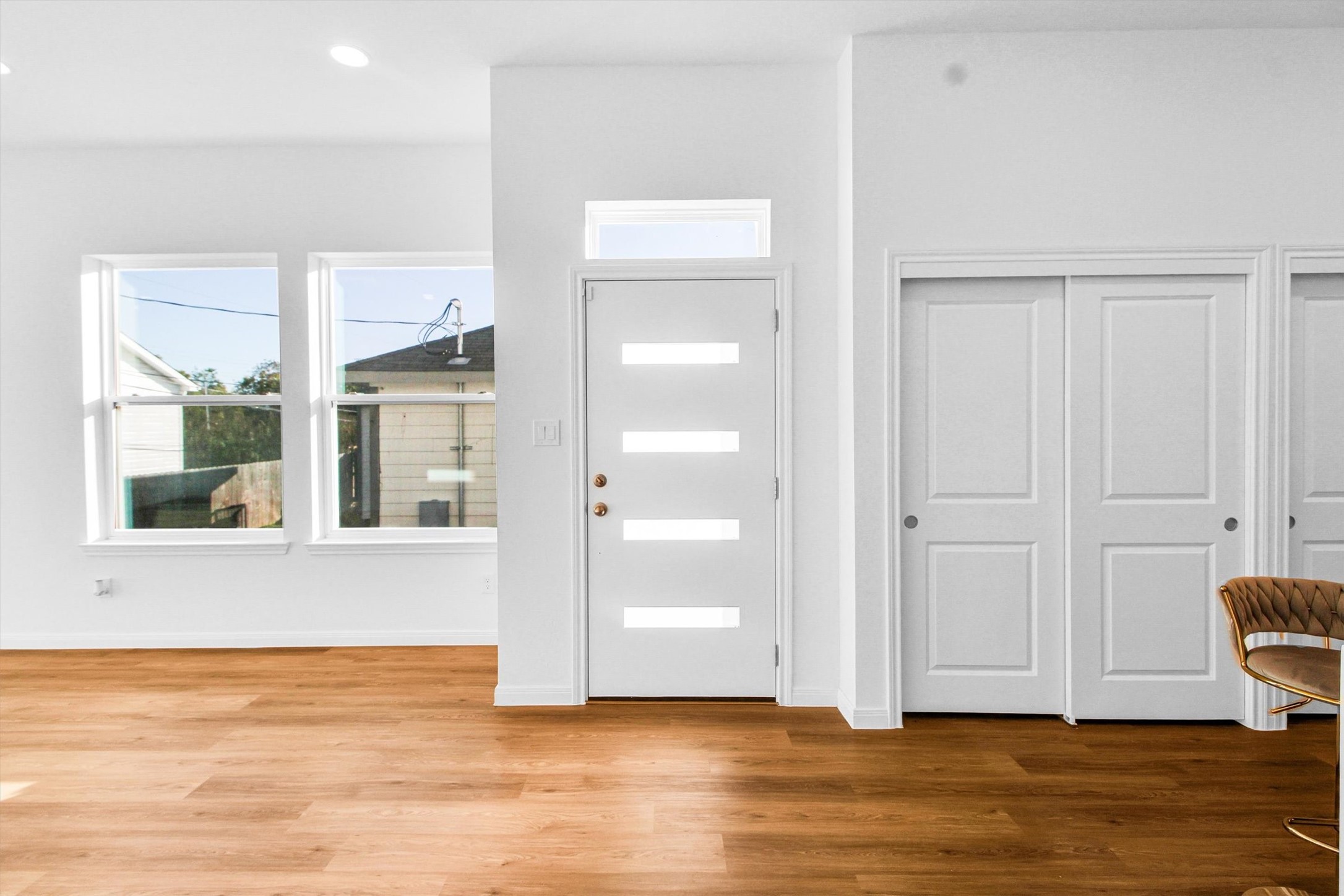 5325 Rue Street Houston, TX 77033 - Photo 5 of 34 a view of an empty room with wooden floor and a window