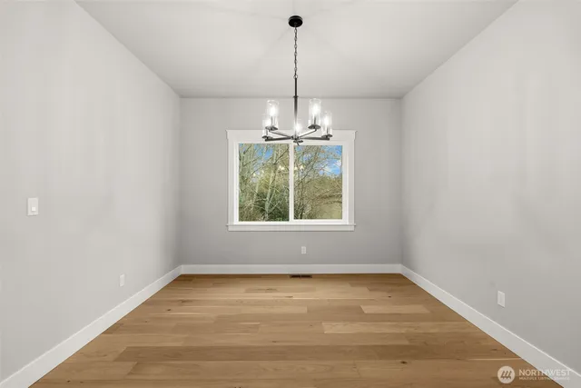 a view of a room with window chandelier and window