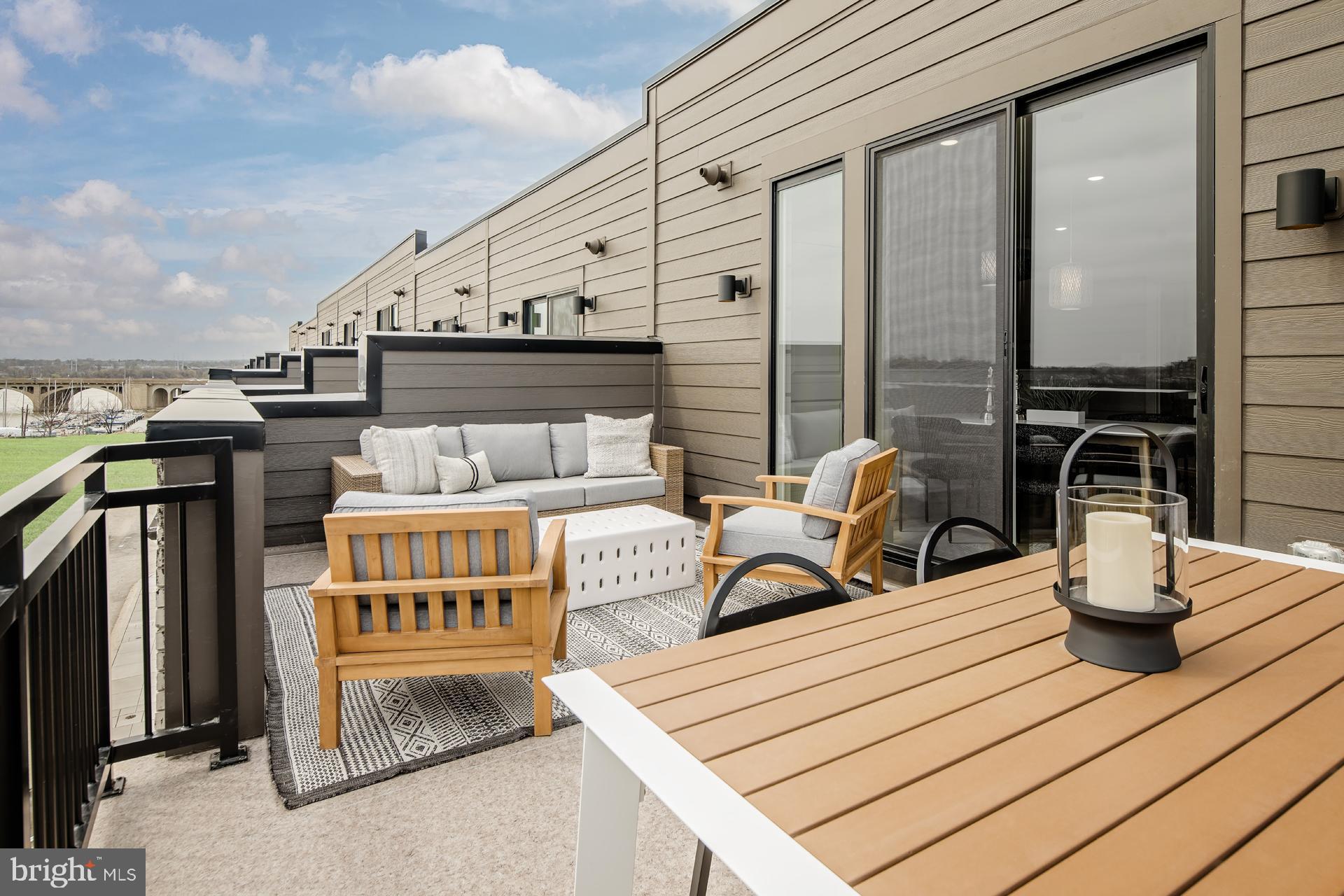 242 Light Street Baltimore, MD 21230 - Photo 19 of 29 a roof deck with couch and chairs