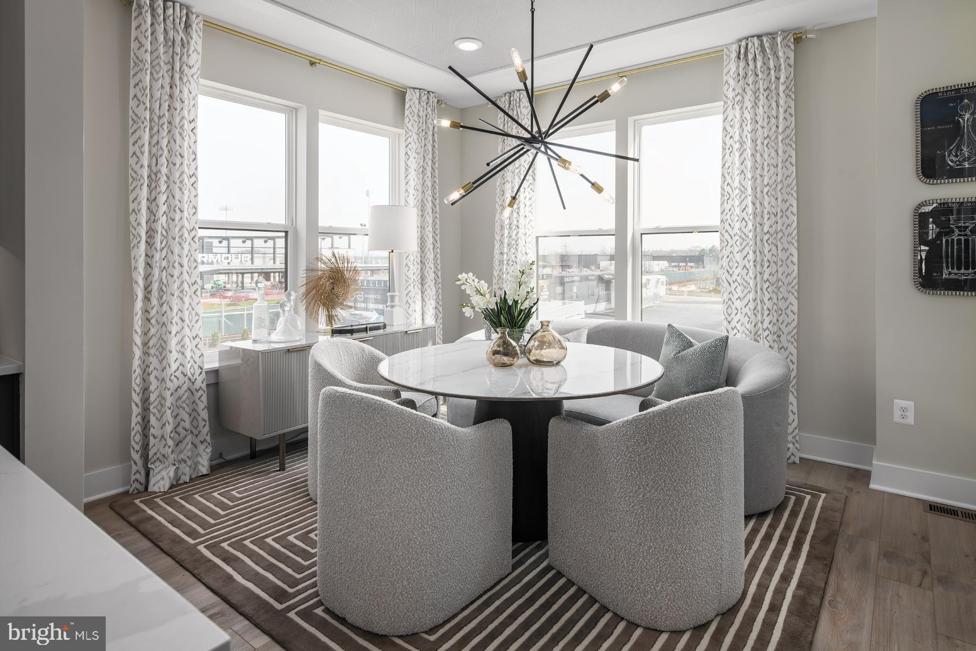 242 Light Street Baltimore, MD 21230 - Photo 8 of 29 a dining room with furniture a chandelier and wooden floor