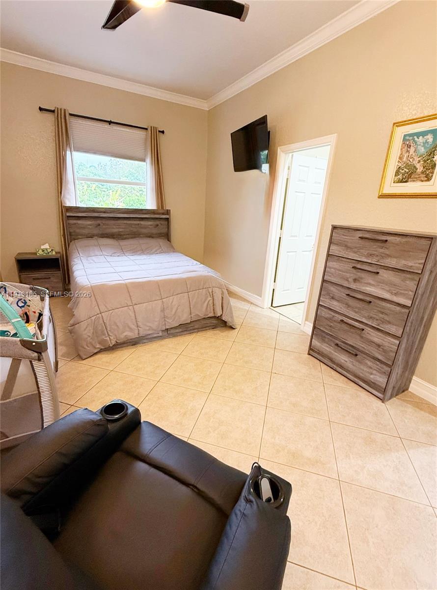 6550 Southwest 183rd Way Southwest Ranches, FL 33331 - Photo 12 of 24 a bedroom with a bed and a cabinets