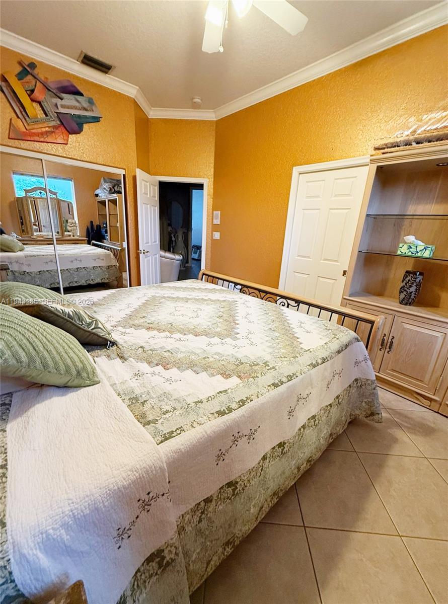 6550 Southwest 183rd Way Southwest Ranches, FL 33331 - Photo 16 of 24 a bed sitting in a bedroom and a night stand