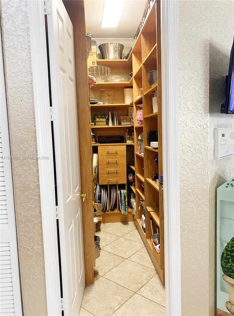 6550 Southwest 183rd Way Southwest Ranches, FL 33331 - Photo 8 of 24 a view of walk in closet with clothes and shoes