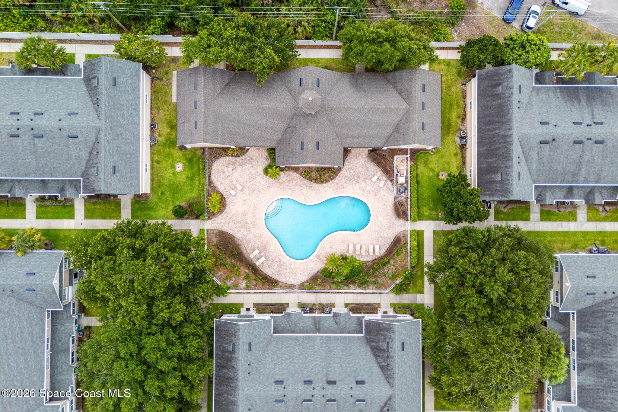 110 Turpial Way, Unit 106 Melbourne, FL 32901 - Photo 39 of 50 an aerial view of residential house with outdoor space and swimming pool