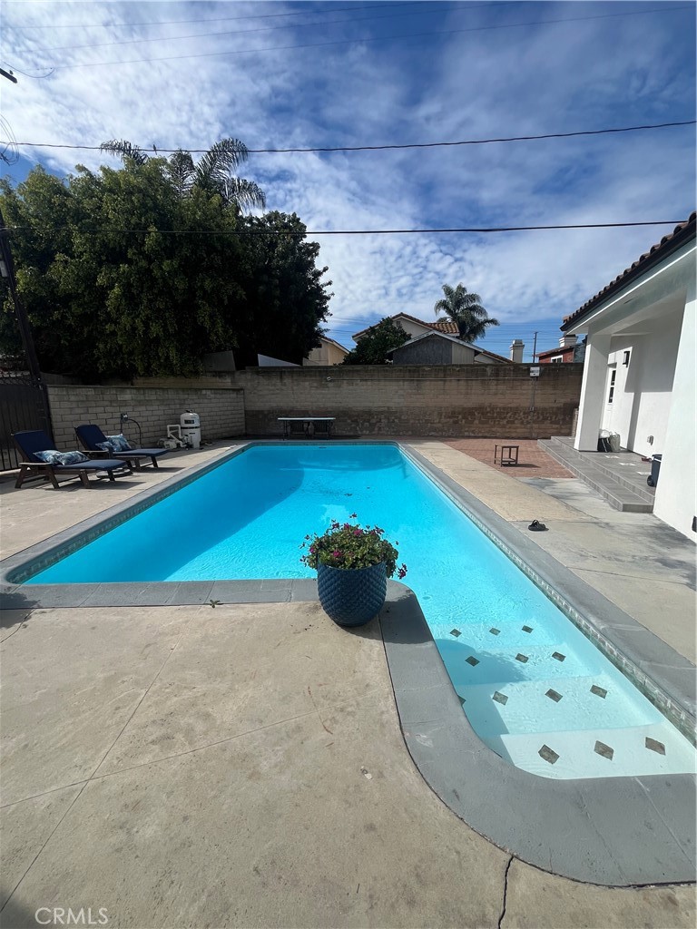 7274 Century Paramount, CA 90723 - Photo 9 of 11 a view of a swimming pool and outdoor space