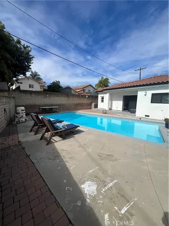 a view of a backyard with sitting area
