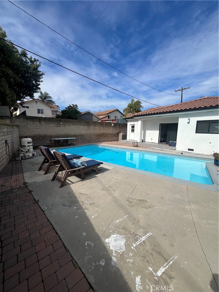 7274 Century Paramount, CA 90723 - Photo 10 of 11 a view of a backyard with sitting area