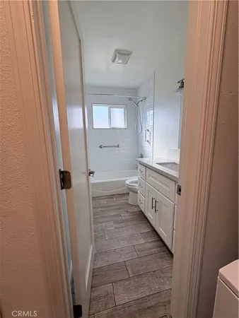 a bathroom with a bathtub and shower
