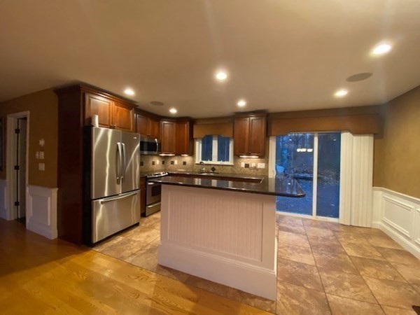 14 Maple Spring Drive Rutland, MA 01543 - Photo 8 of 29 a kitchen with stainless steel appliances granite countertop a refrigerator and a stove top oven