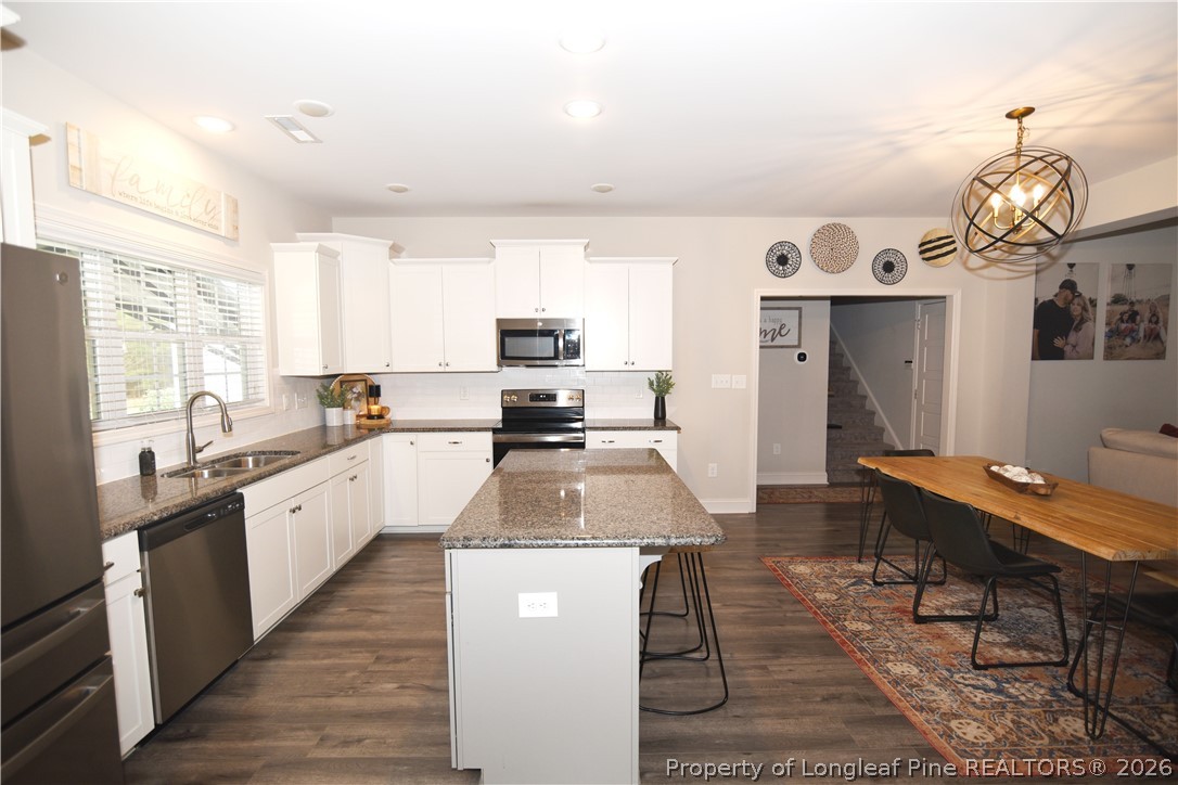 1843 Meadow Road Lumberton, NC 28358 - Photo 11 of 35 a large kitchen with granite countertop lots of counter top space and stainless steel appliances