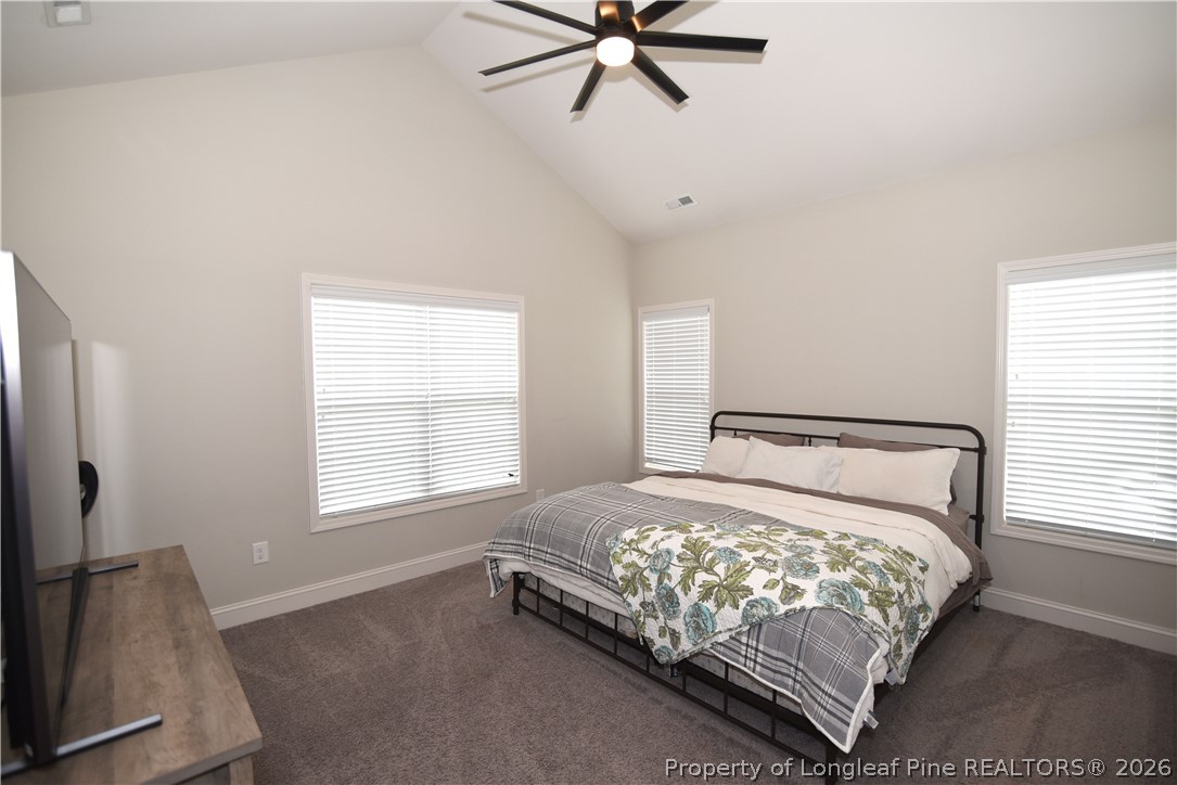 1843 Meadow Road Lumberton, NC 28358 - Photo 13 of 35 a bed sitting in a bedroom next to a window