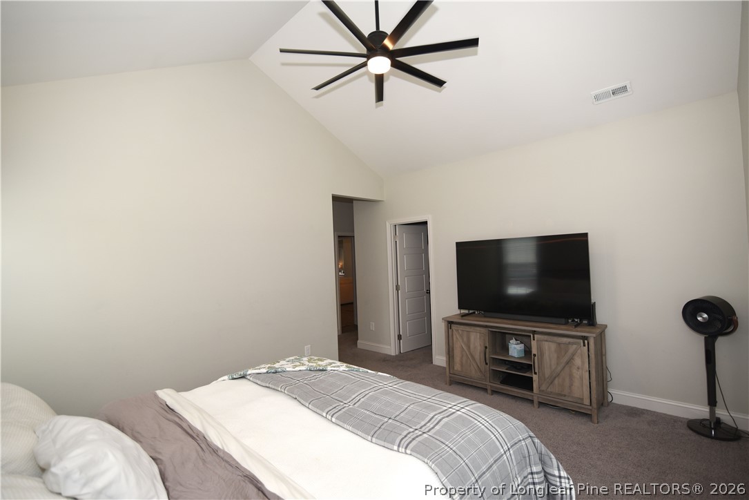 1843 Meadow Road Lumberton, NC 28358 - Photo 14 of 35 a bedroom with a bed and a flat screen tv