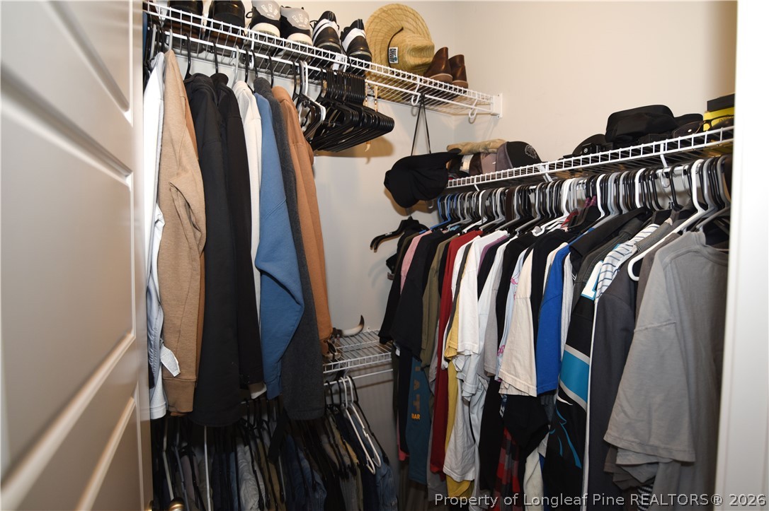 1843 Meadow Road Lumberton, NC 28358 - Photo 20 of 35 a view of walk in closet with clothes and shoes