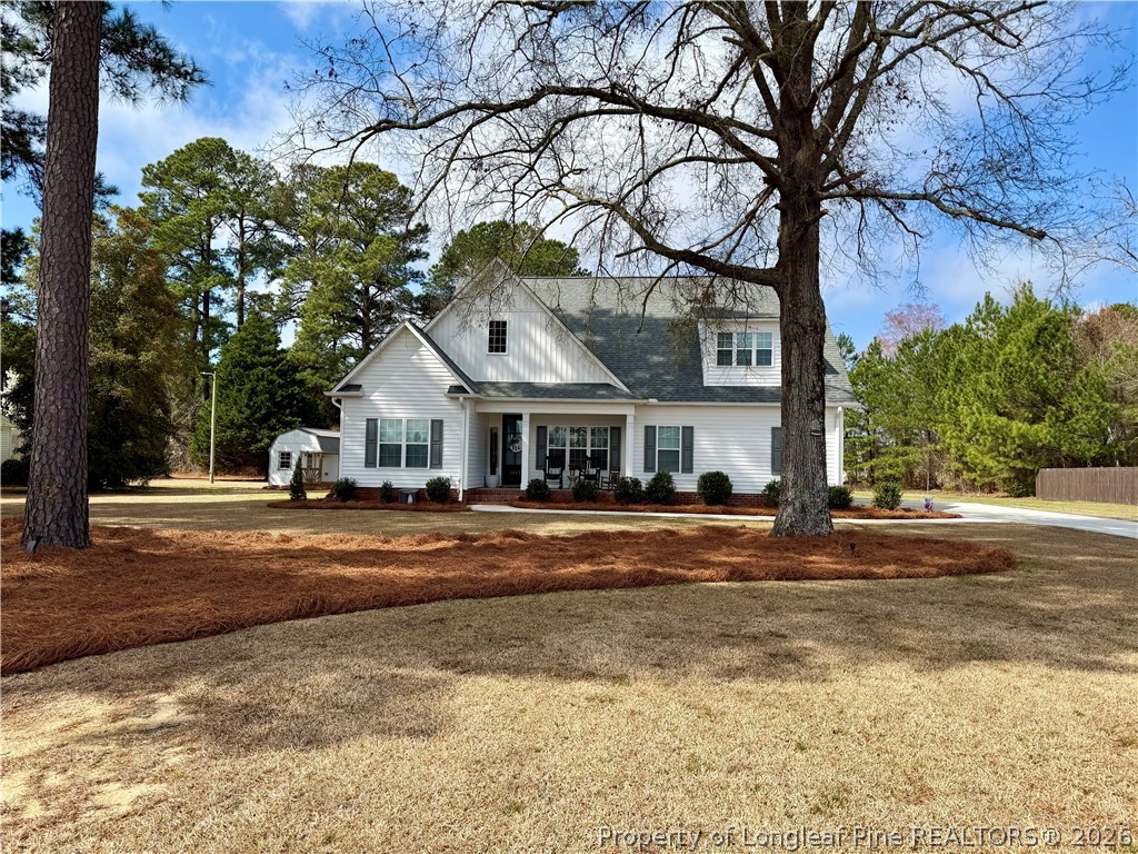 1843 Meadow Road Lumberton, NC 28358 - Photo 3 of 35 a front view of residential houses with yard and trees