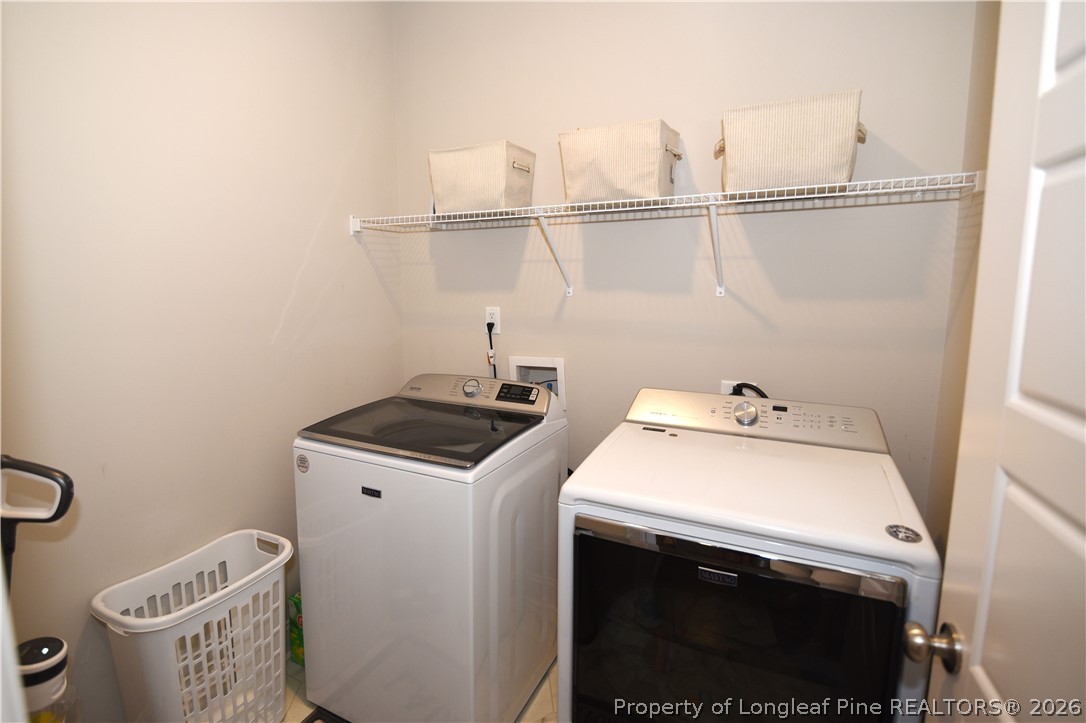 1843 Meadow Road Lumberton, NC 28358 - Photo 32 of 35 a utility room with dryer and washer