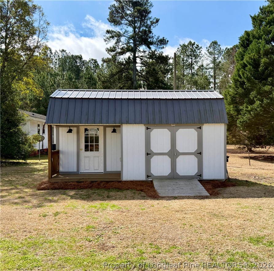 1843 Meadow Road Lumberton, NC 28358 - Photo 33 of 35 a view of a house with backyard and garden