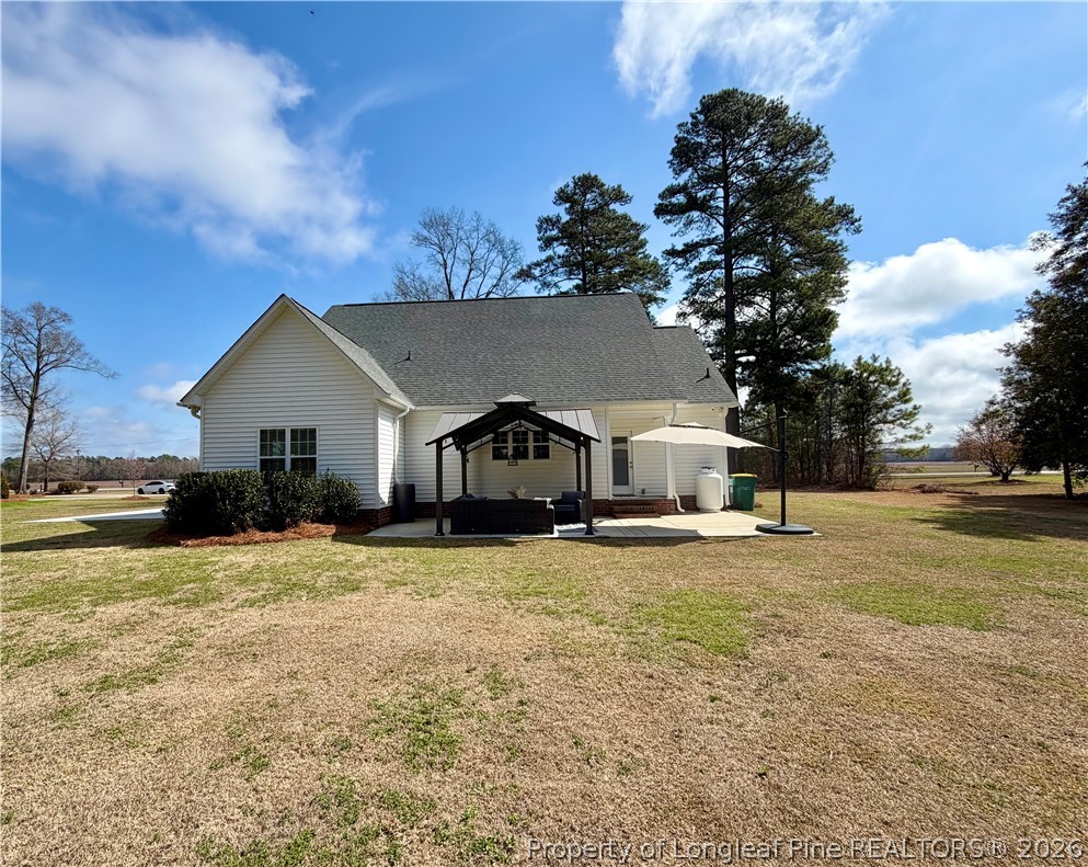 1843 Meadow Road Lumberton, NC 28358 - Photo 35 of 35 a front view of a house with a yard and garage