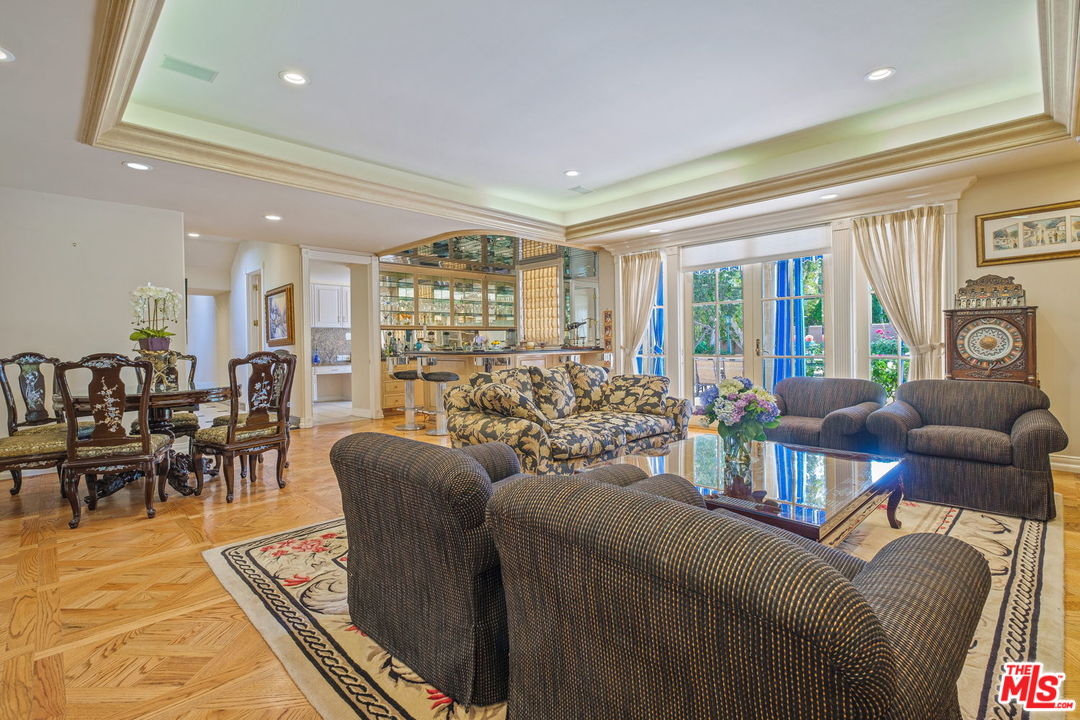 511 North Canon Drive Beverly Hills, CA 90210 - Photo 11 of 34 a living room with furniture and a large window
