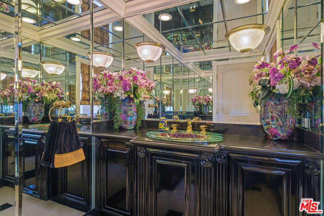 511 North Canon Drive Beverly Hills, CA 90210 - Photo 18 of 34 a bunch of flowers sitting in front of a building