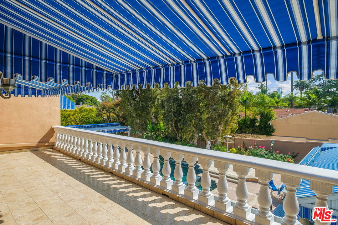 511 North Canon Drive Beverly Hills, CA 90210 - Photo 24 of 34 a view of a house with a small yard