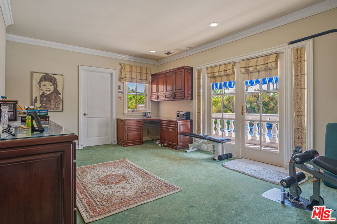 511 North Canon Drive Beverly Hills, CA 90210 - Photo 28 of 34 a living room with furniture and a window