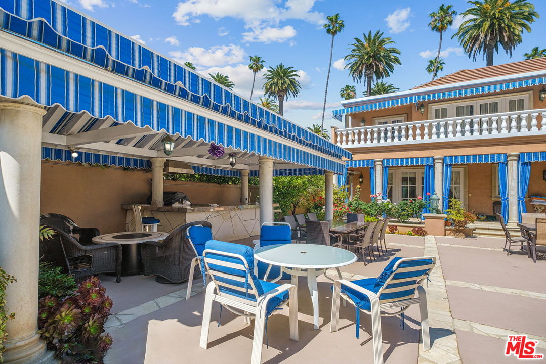 511 North Canon Drive Beverly Hills, CA 90210 - Photo 33 of 34 a view of a cafe with sitting area