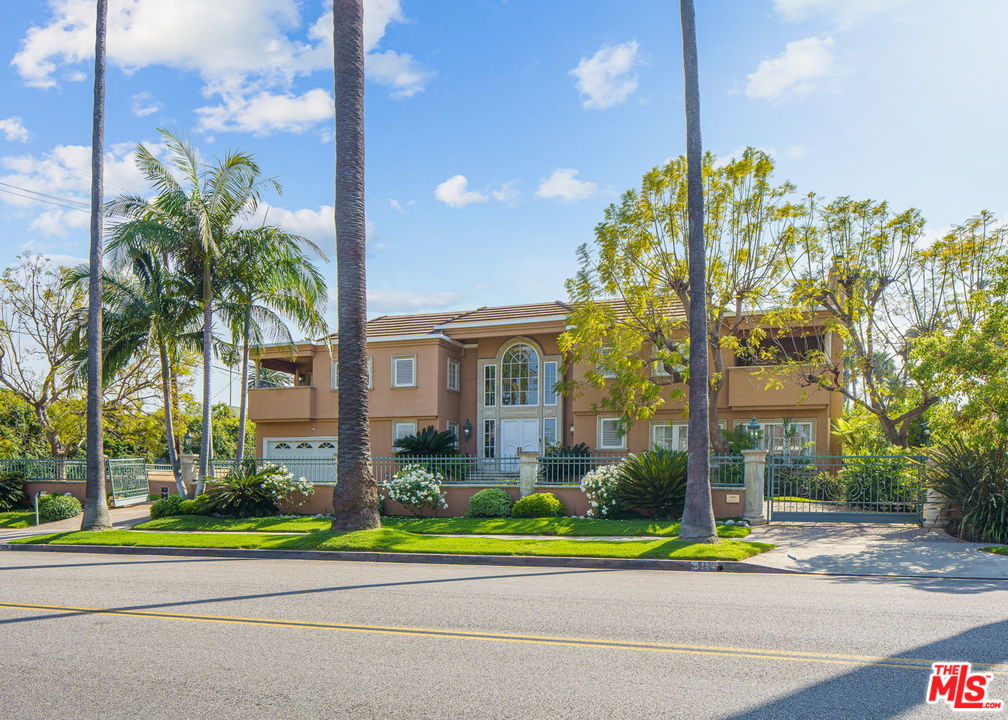 511 North Canon Drive Beverly Hills, CA 90210 - Photo 34 of 34 a view of yellow house with a big yard and plants