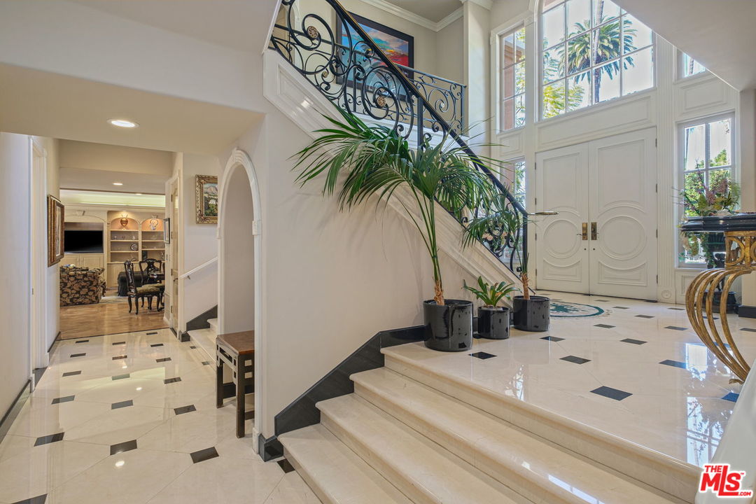 511 North Canon Drive Beverly Hills, CA 90210 - Photo 7 of 34 a bathroom with a sink a mirror and shower