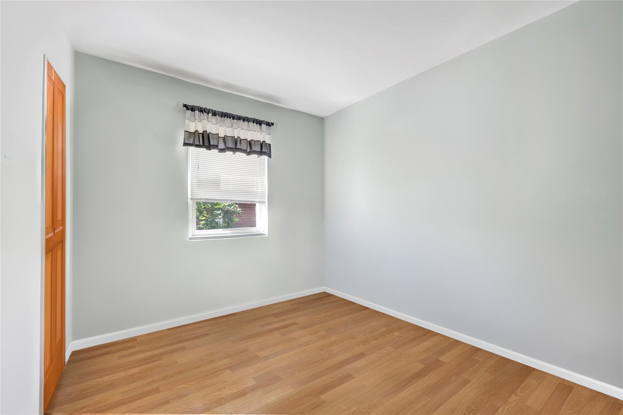 151-84 17th Road Queens, NY 11357 - Photo 8 of 17 Unfurnished room with light wood-type flooring and baseboards