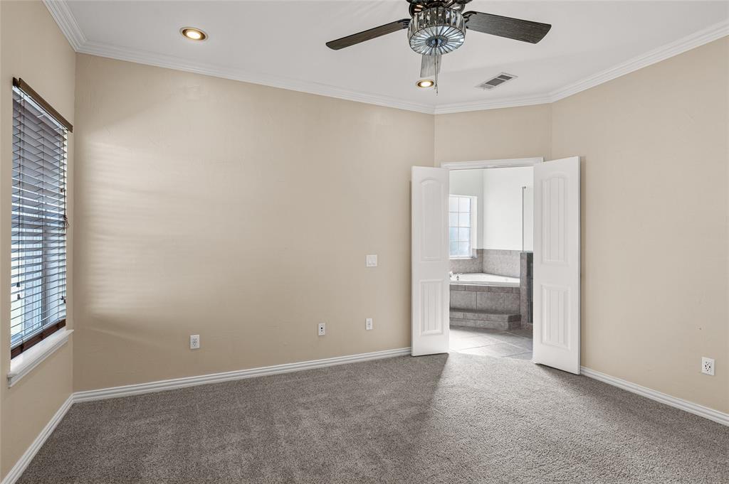 10264 Farmington Road Van Alstyne, TX 75495 - Photo 16 of 39 a view of a room with a ceiling fan and a bathroom