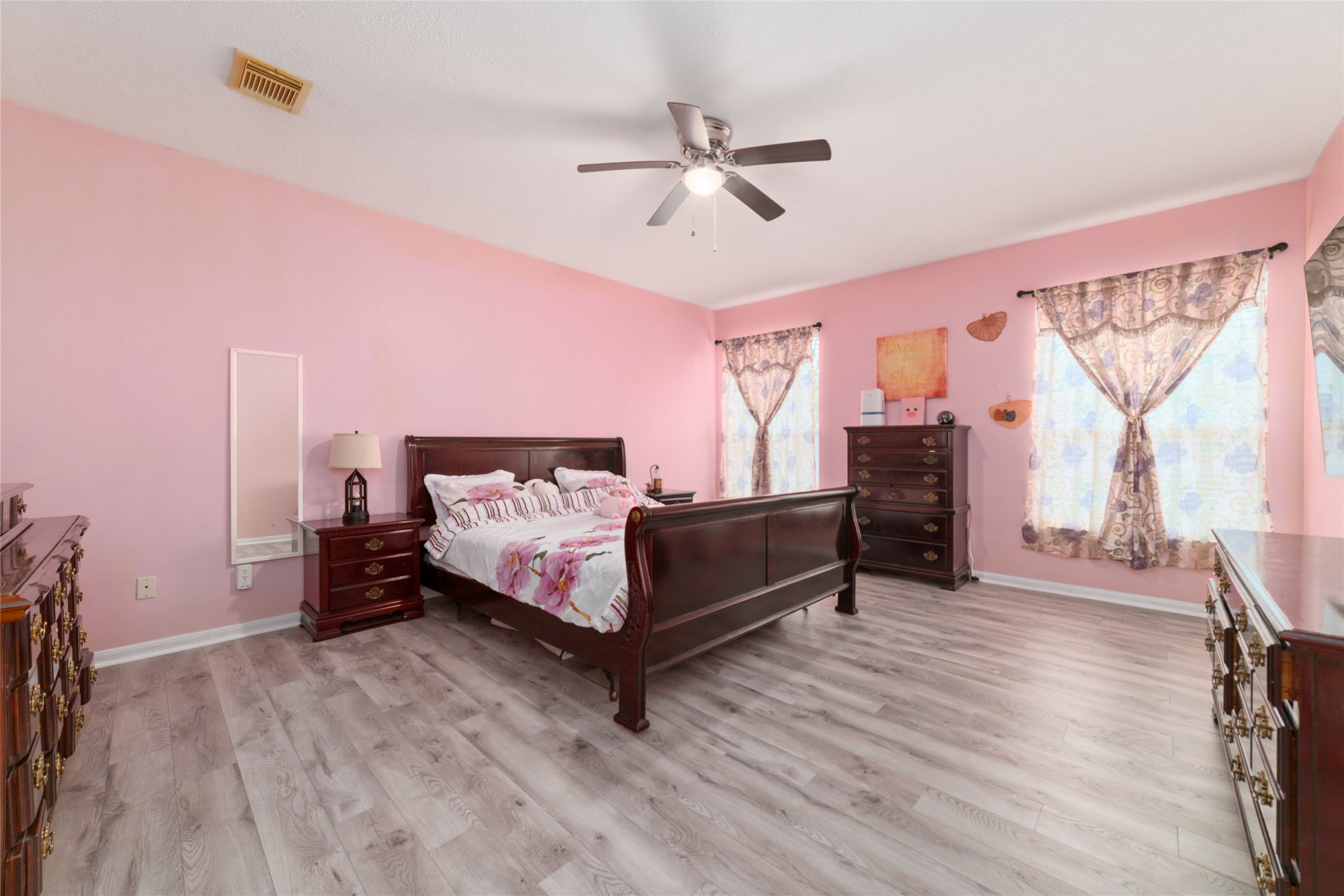 9003 Memorial Hills Drive Spring, TX 77379 - Photo 17 of 39 a bedroom with a bed and a chandelier