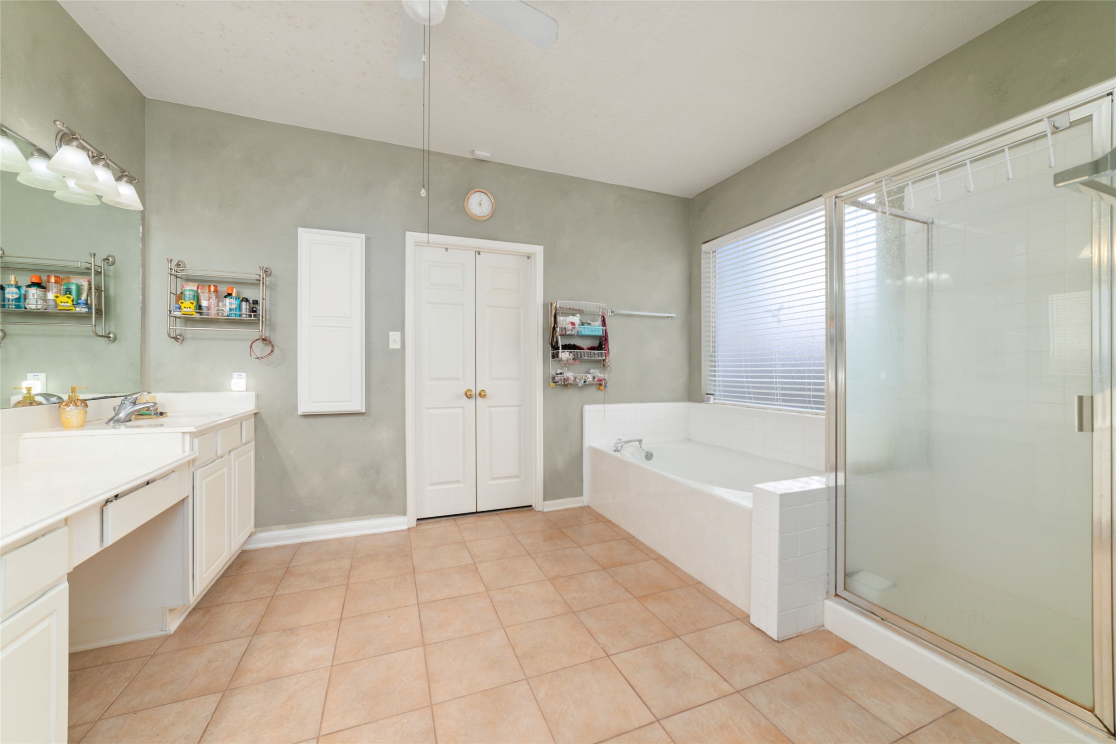 9003 Memorial Hills Drive Spring, TX 77379 - Photo 19 of 39 a spacious bathroom with a tub shower and sink
