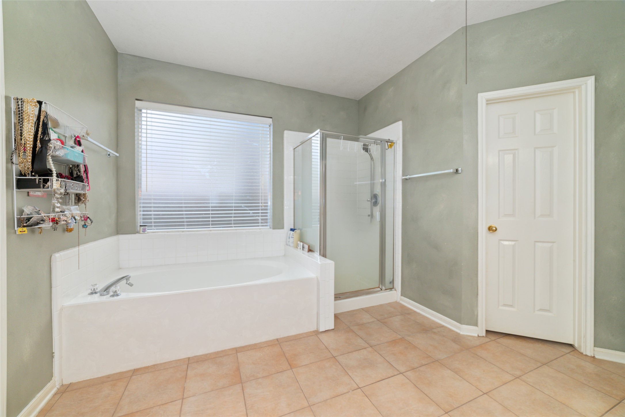 9003 Memorial Hills Drive Spring, TX 77379 - Photo 21 of 39 a white bath tub sitting next to a bathroom