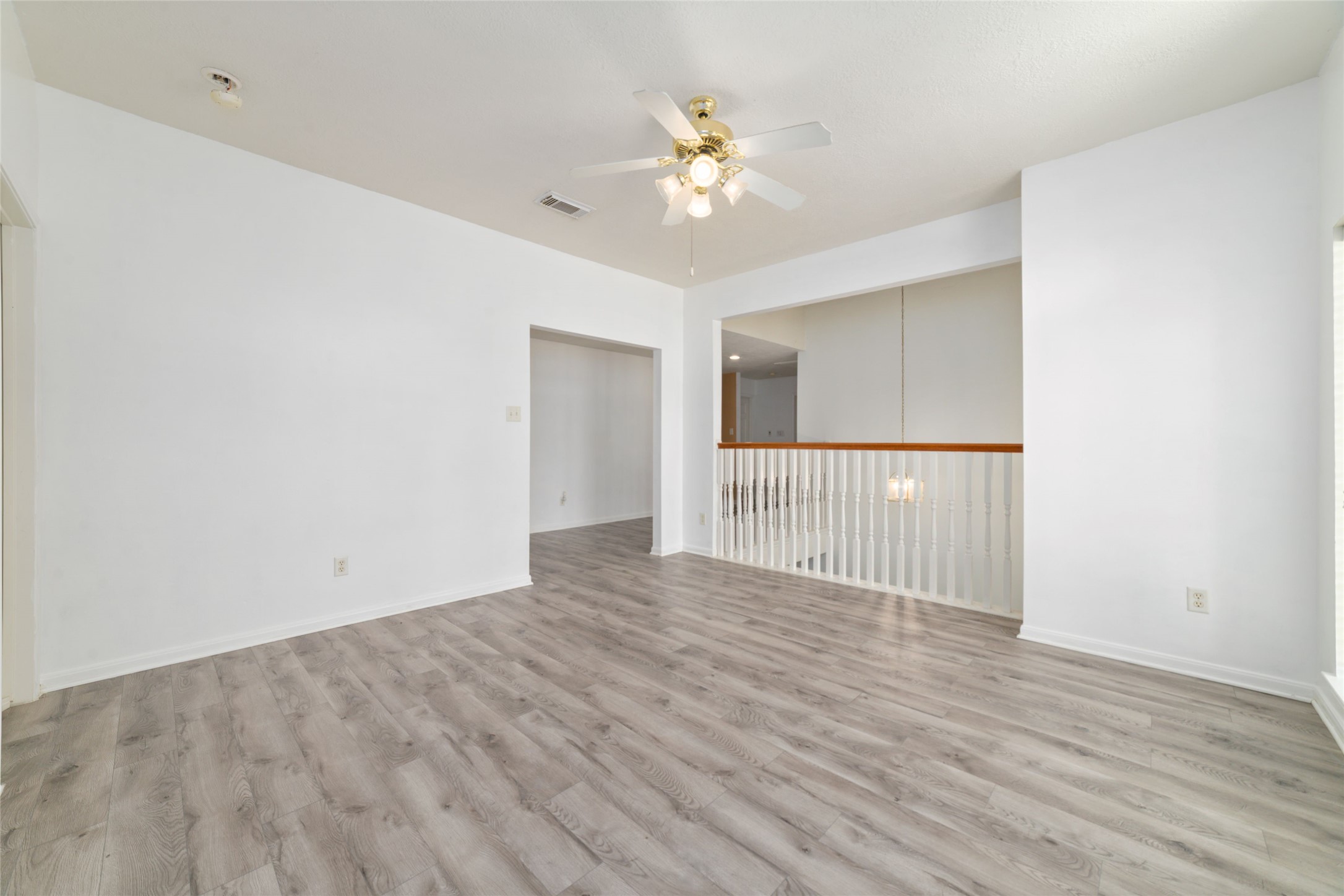 9003 Memorial Hills Drive Spring, TX 77379 - Photo 25 of 39 wooden floor in an empty room with a window