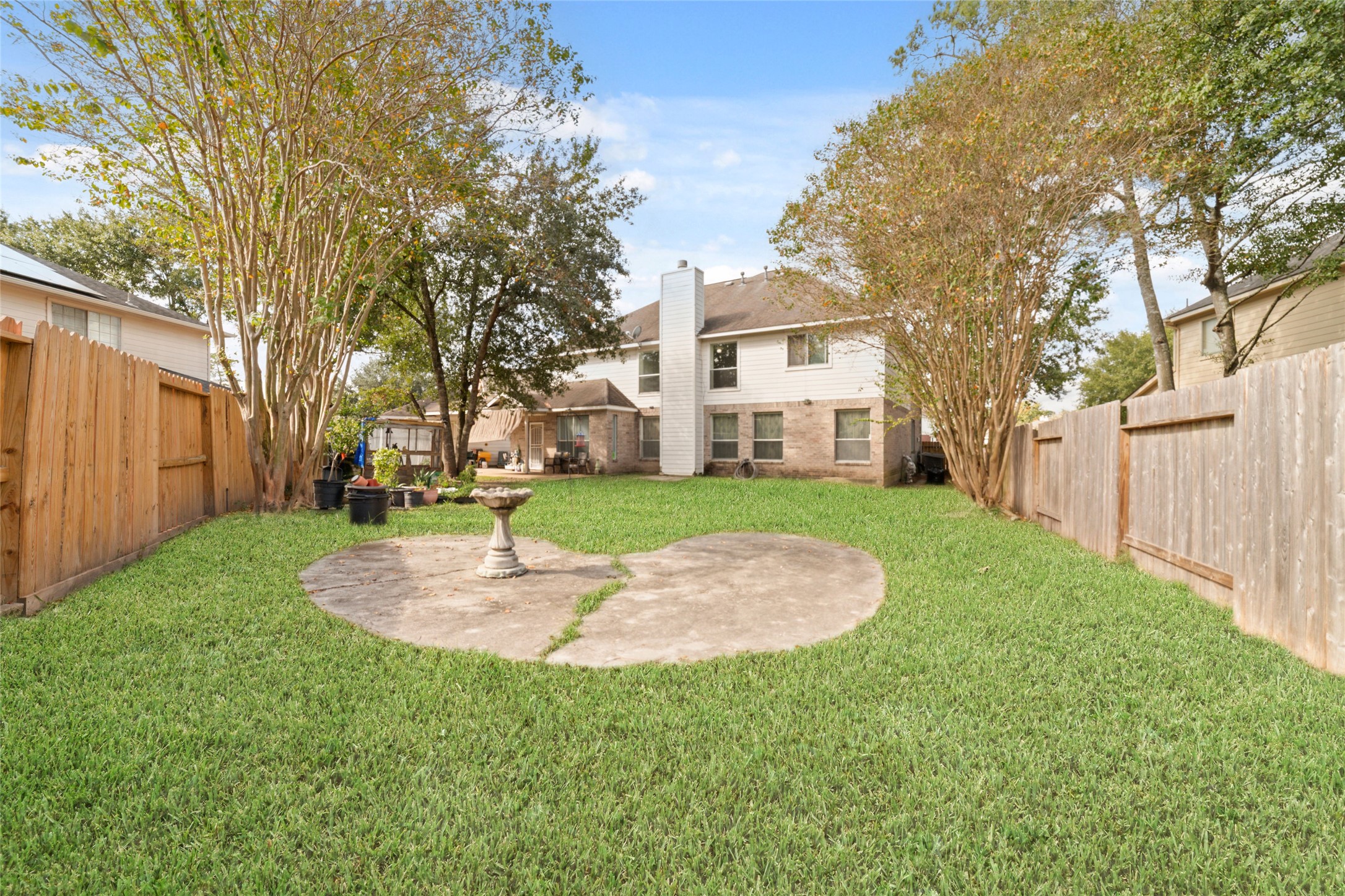 9003 Memorial Hills Drive Spring, TX 77379 - Photo 37 of 39 a view of a house with a yard porch and sitting area