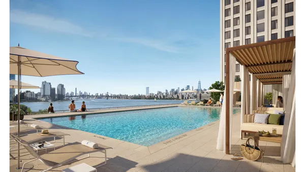a view of a swimming pool and a lounge chairs