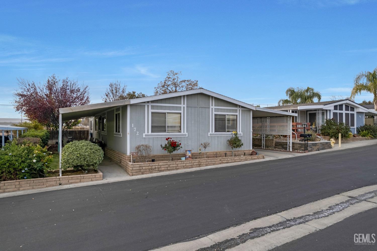 front view of a house with a sitting area