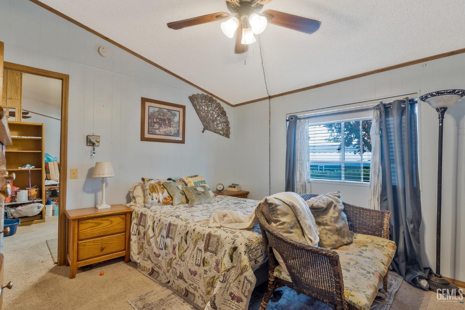 Undisclosed Address Bakersfield, CA 93306 - Photo 11 of 26 a bedroom with furniture and a window